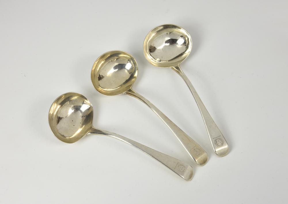 A set of three of George III silver Old English pattern sauce ladles Solomon Hougham, London 1804, with sun crest to terminals,
