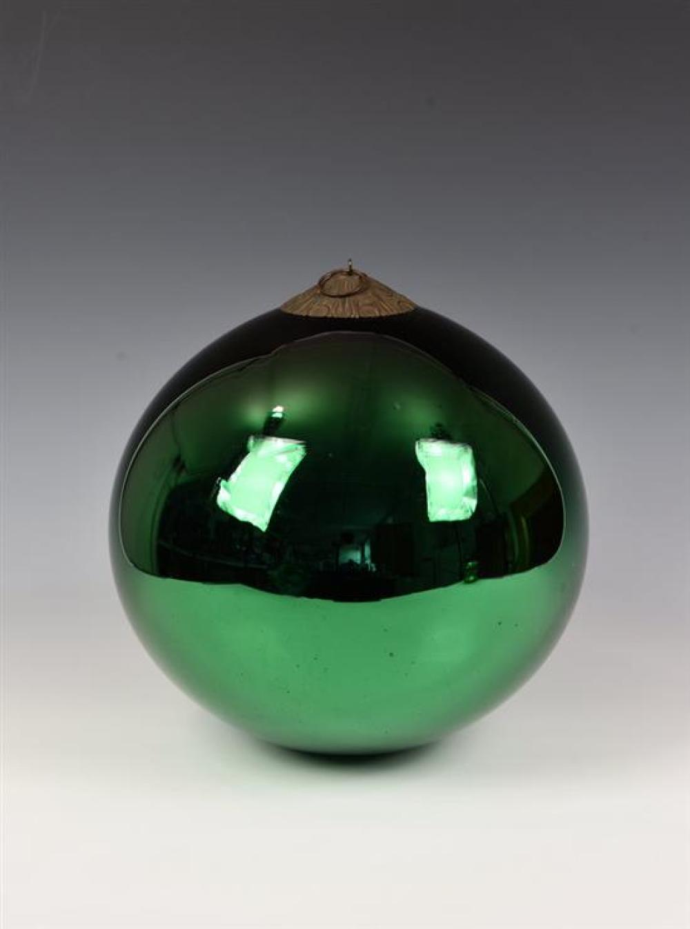 A large 19th century green glass witches ball having a mirrored effect, ornate circular metal hanging mount to top,