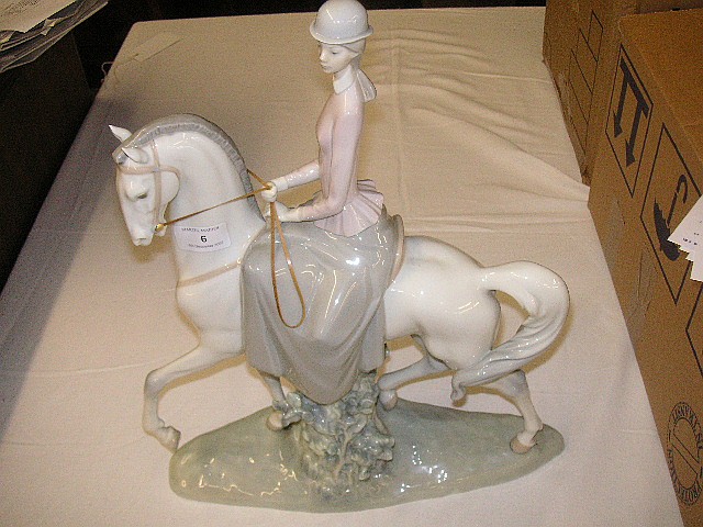A Lladro female and horse g... image