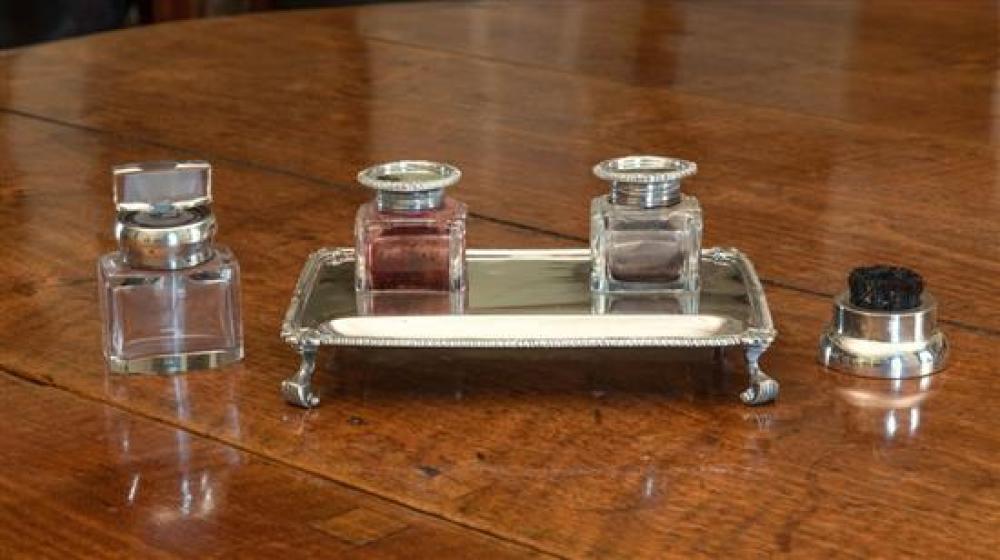 A George V silver double inkwell desk stand Garrard & Co Ltd, London, 1917, the rectangular desk stand with gadrooned and acanthus rim,