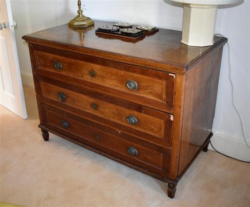 A late 18th century French three drawer cherrywood commode the step moulded top with boxwood banding,