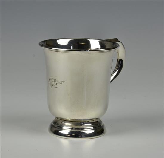 An Elizabeth II silver tankard Barker Brothers Silver Ltd, Birmingham, 1961, of baluster form with scrolled handle,