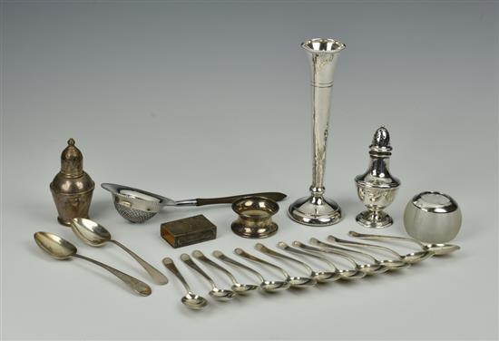 A collection of silver smalls comprising of a tea strainer with wooden turned handle by Gorham Manufacturing Co, Birmingham,