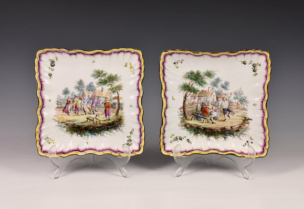 A pair of 19th century Continental porcelain plates imitating enamel, of wavy edge and ribbed square form,