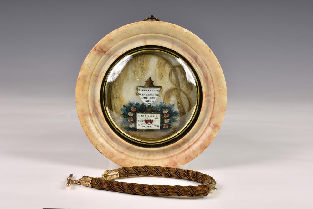 A George III woven hair and painted Mourning memorial picture in circular marble frame memorial picture under convex glass,