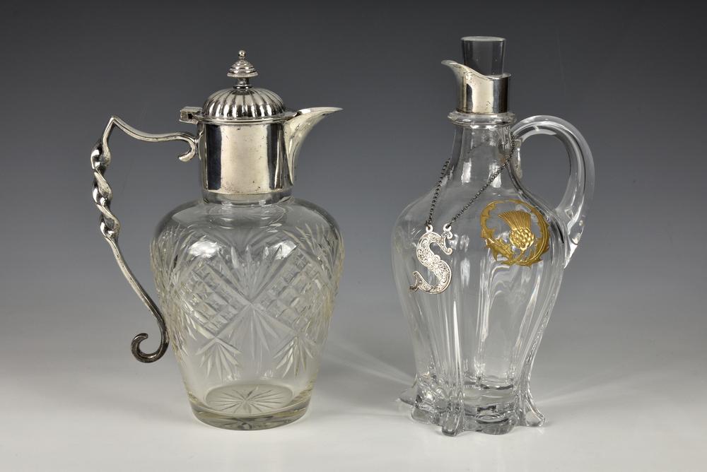 An early Edwardian silver mounted claret jug Norton & White, Birmingham, 1901, of elongated ribbed bulbous form on spreading foot,