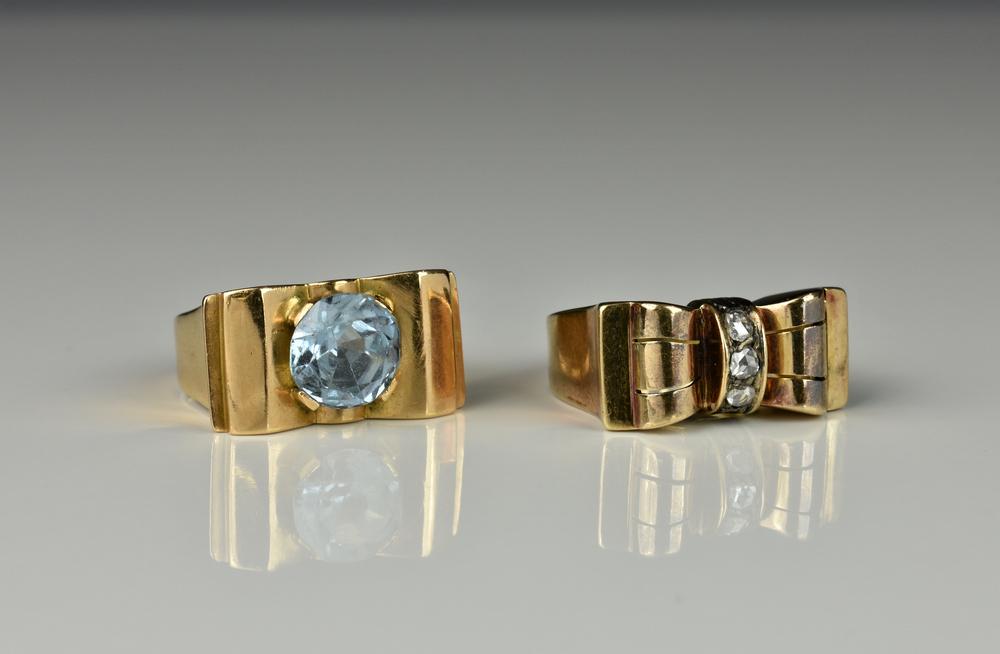 Two mid-century Continental 18ct gold rings both with bow shaped settings, one with three rose cut diamonds,