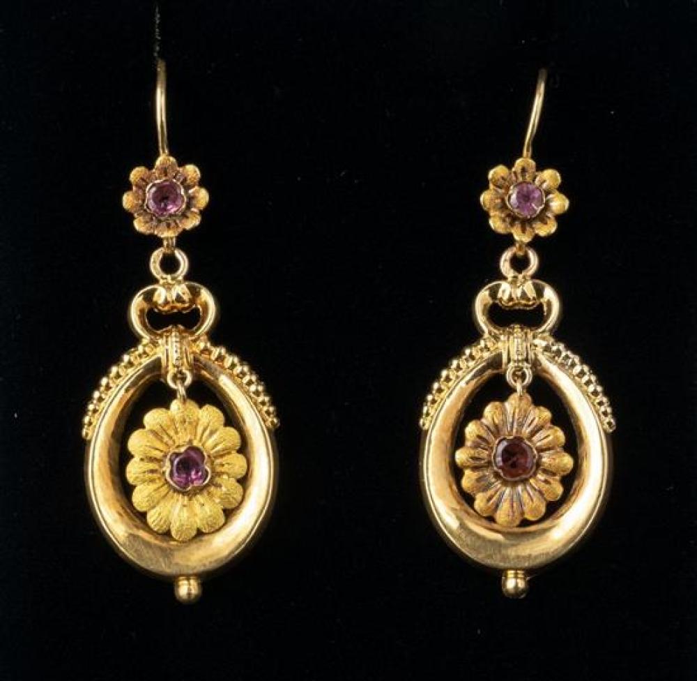 A pair of vintage French 18ct gold and almandine garnet drop earrings the oval stirrup drops with central garnet set flower,