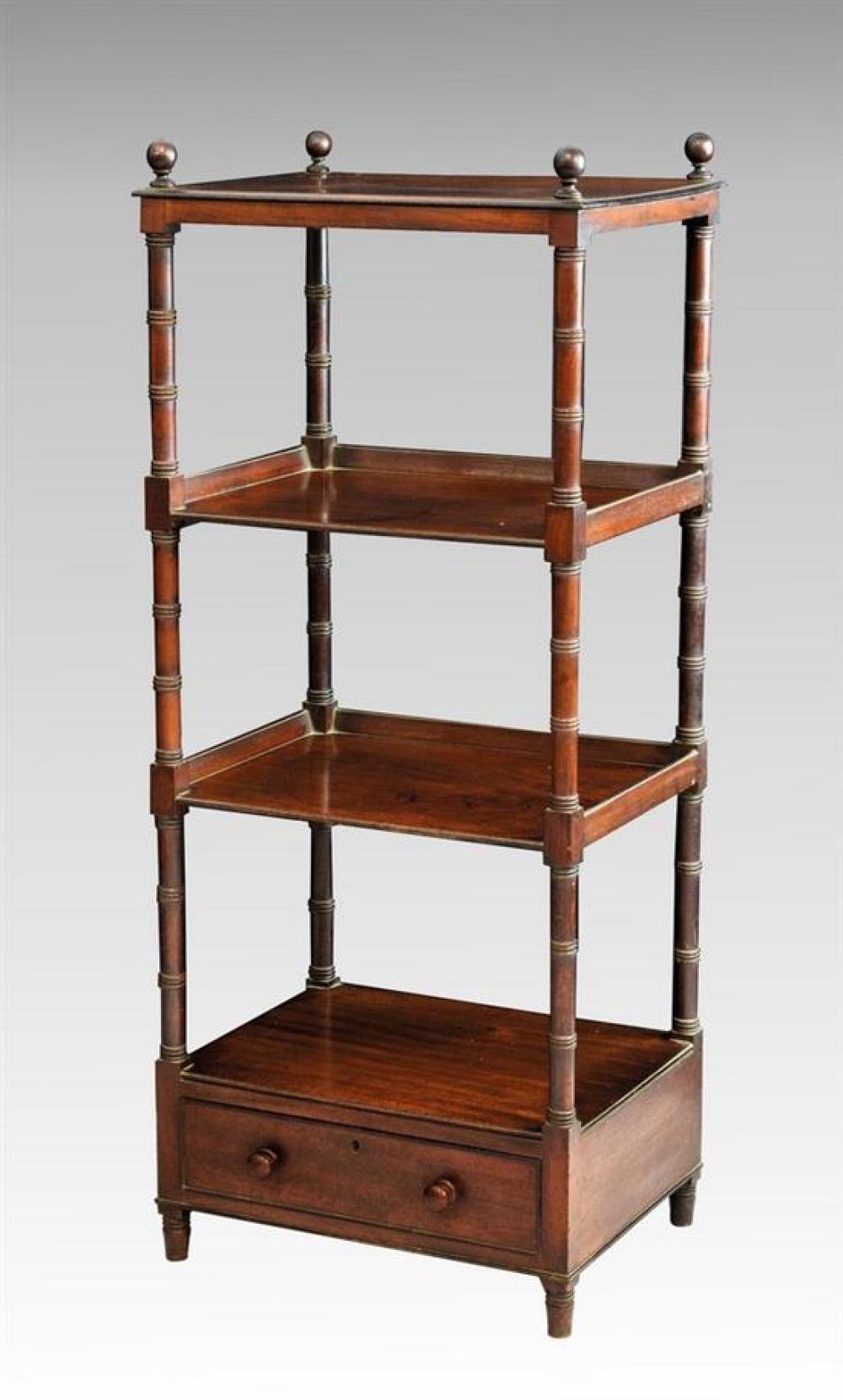 A late Regency four tier mahogany whatnot the top tier with four ball finials, the centre two tiers with three quarter galleries,