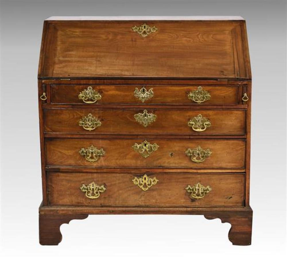 A George III mahogany bureau the well figured fall front enclosing a fitted interior with central cupboard flanked by blind fret car...