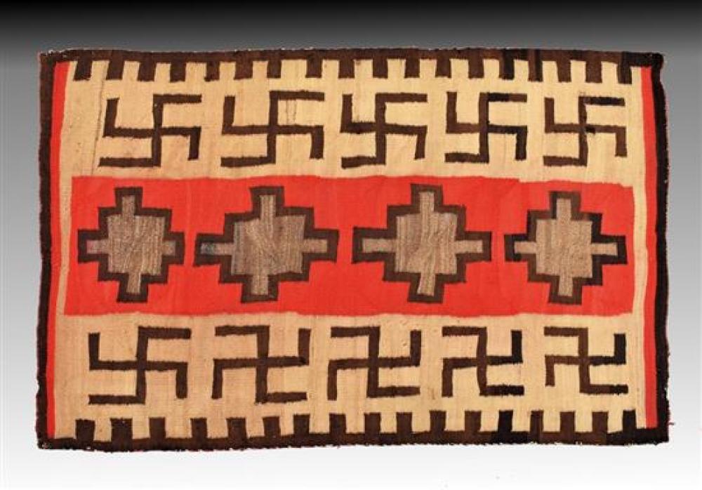 An antique Navajo rug with 'Rolling Log' design c.1910-20, woven in red, dark brown, light brown and natural ivory wool,