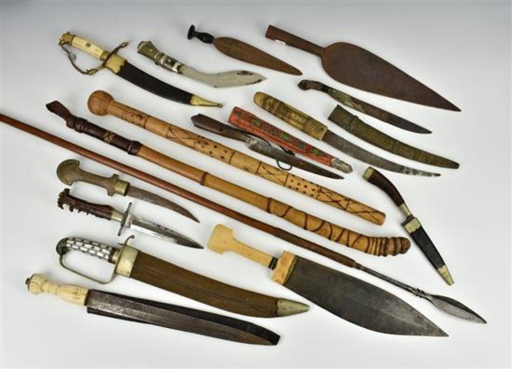 A large collection of weaponry comprising of a tribal African throwing spear; tapering leaf shape spearhead with all over script lik...