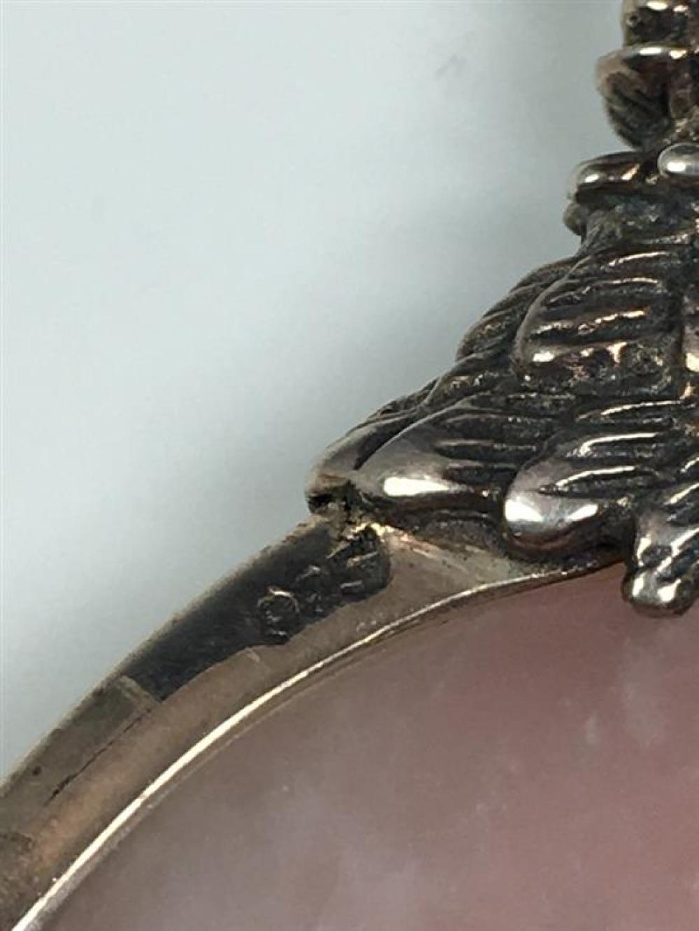 A Rose Quartz pi disc pendant with silver mount of circular form with feathered mount and hanging loop, marked 925,