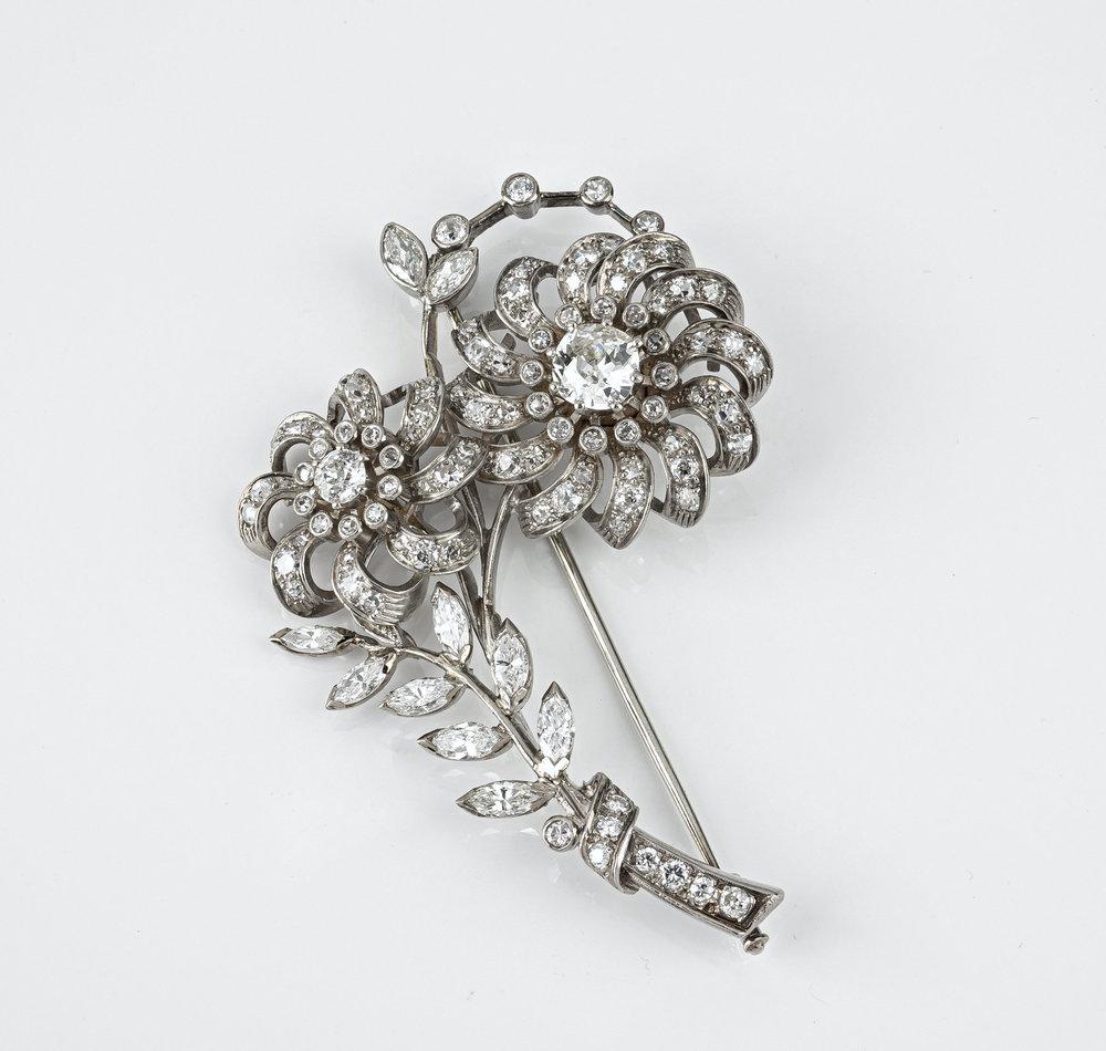 A fine early 20th century 18ct white gold and diamond floral brooch 1920s-30s, designed as a floral spray,