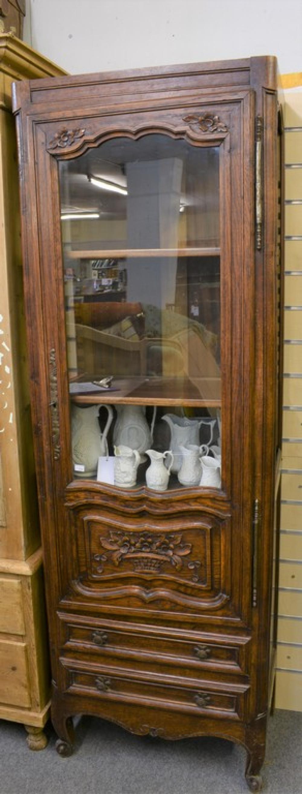An antique part glazed mahogany display case, A/F, glazed on three sides with four shelves over three pull out drawers.