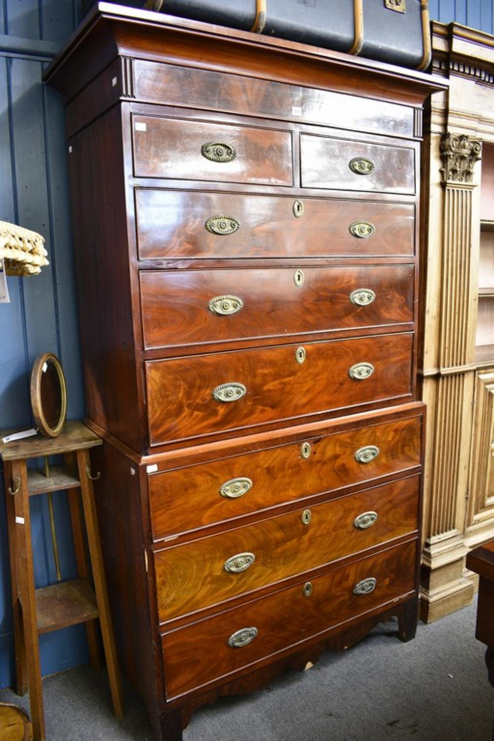 A Regency Channel Islands inlaid mahogany chest on chest