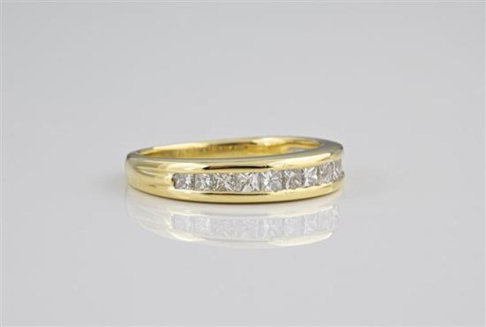 An 18ct yellow gold and diamond half eternity ring channel set with twelve graduated princess cut diamonds, total weight 0.75ct,