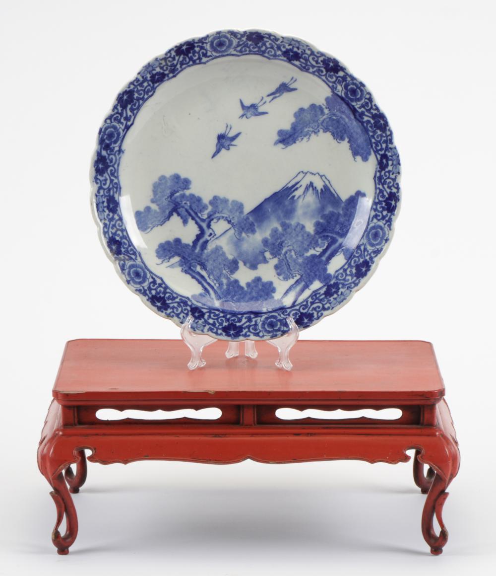 Japanese Carved Red Lacquer Four-legged "Ozen" Tray Table and a Porcelain Charger