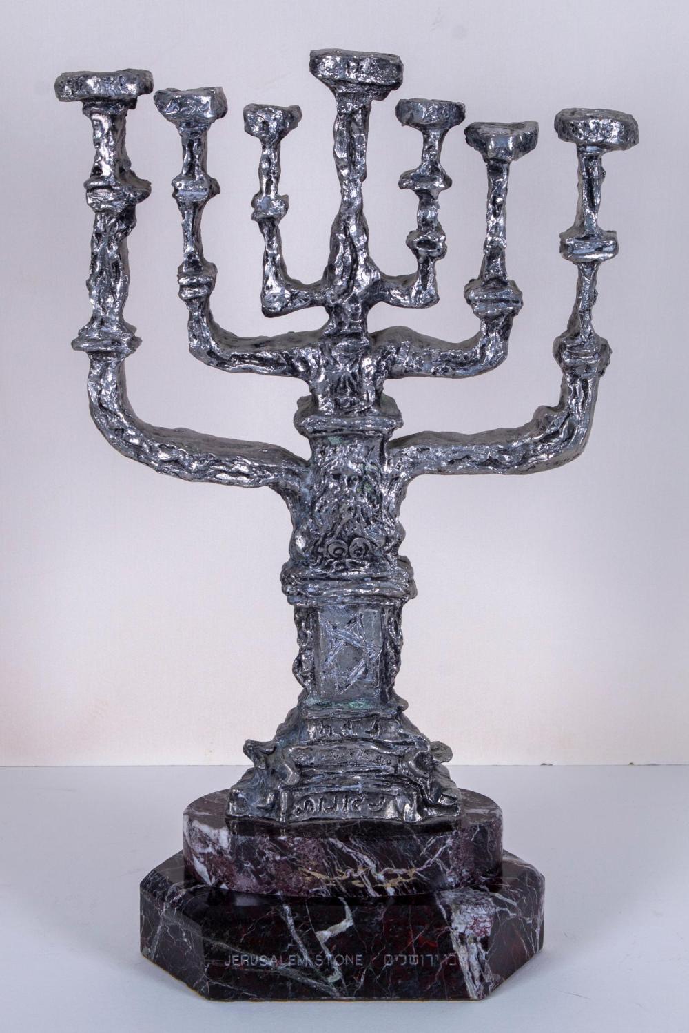 **Salvador Dali 1904-1989 (Spanish) Menora, 1980-81 cast bronze sculpture with silver finish mounted to Jerusalem stone base
