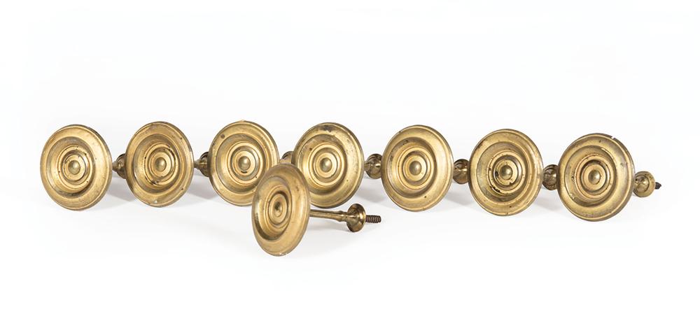 Eight American Brass Tie Backs