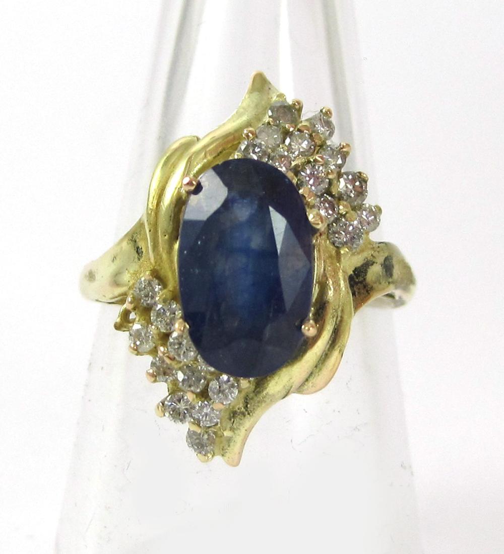 SAPPHIRE, DIAMOND AND FOURTEEN KARAT GOLD RING, wi