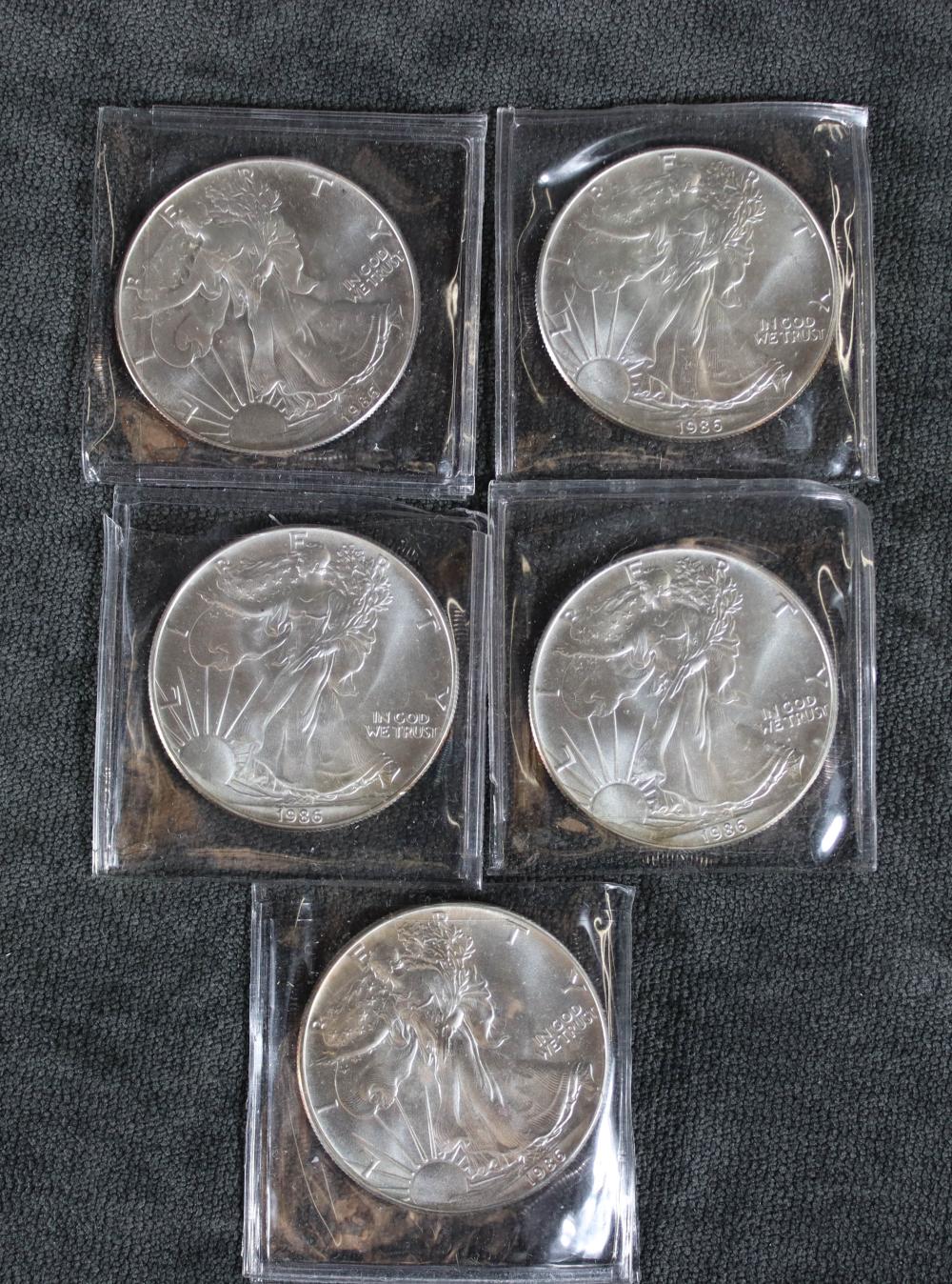 FIVE AMERICAN EAGLE SILVER DOLLARS