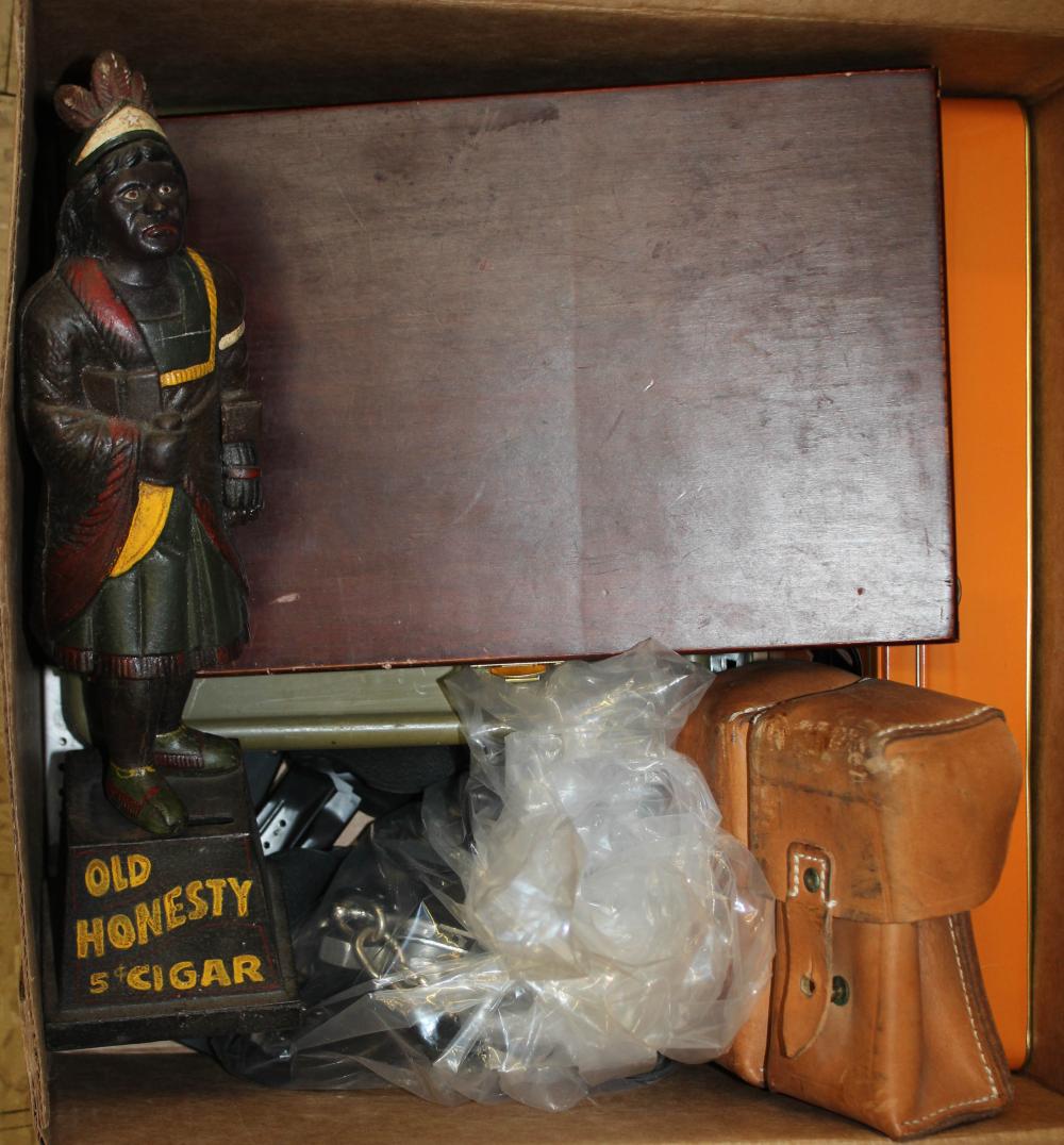 CAST IRON BANK, GUN CLEANING SUPPLIES AND HANDCUFFS.