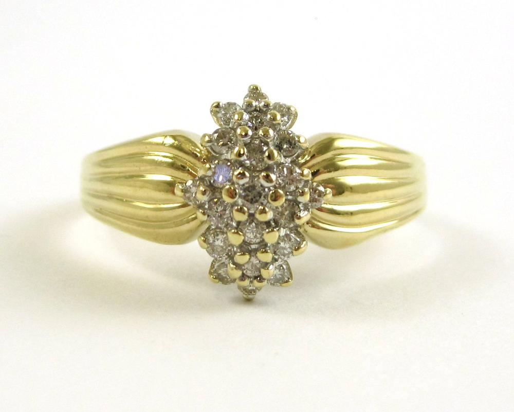 DIAMOND AND FOURTEEN KARAT GOLD RING. The 14k yel