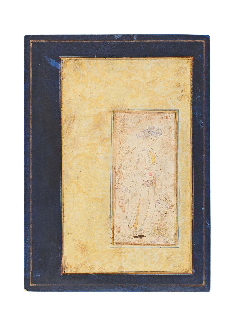 AN ILLUMINATED SAFAVID MINIATURE OF A YOUTH HOLDING A POMEGRANATE, 17TH CENTURY