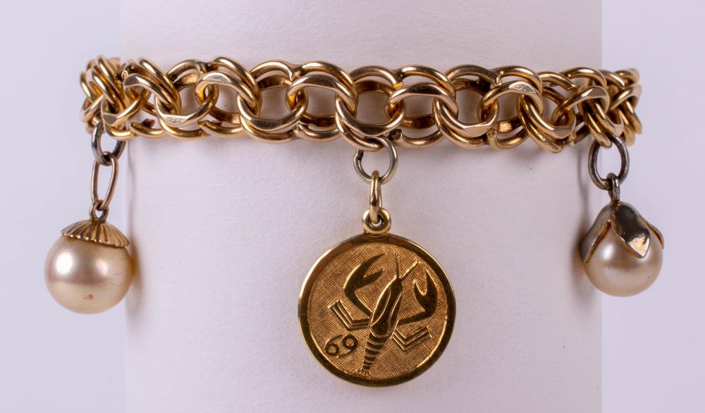 14K YELLOW GOLD DOUBLE LINK CHARM BRACELET WITH TWO CHARMS AND TWO PEARLS Length: 7 1/4 in. (18.4 cm.)