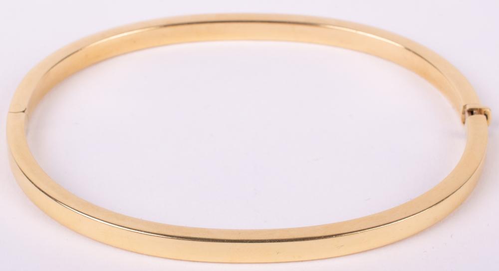 18K YELLOW GOLD BANGLE BRACELET Max. internal width: 2 1/2 in. (6.4 cm.)