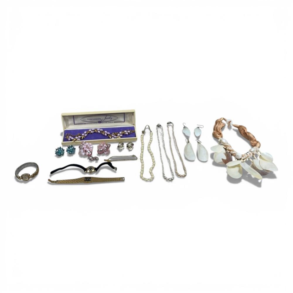 collection of vintage costume jewelry including