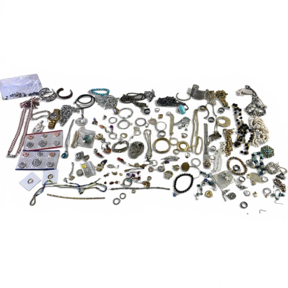 Assortment of costume jewelry with some silver