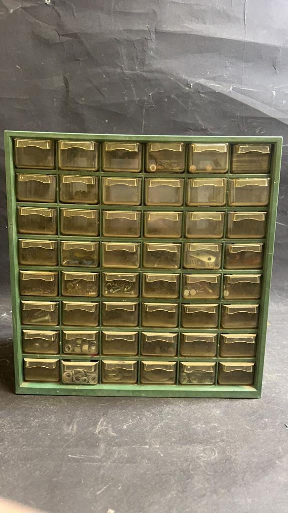 Hardware holder full of nuts, screws and washers