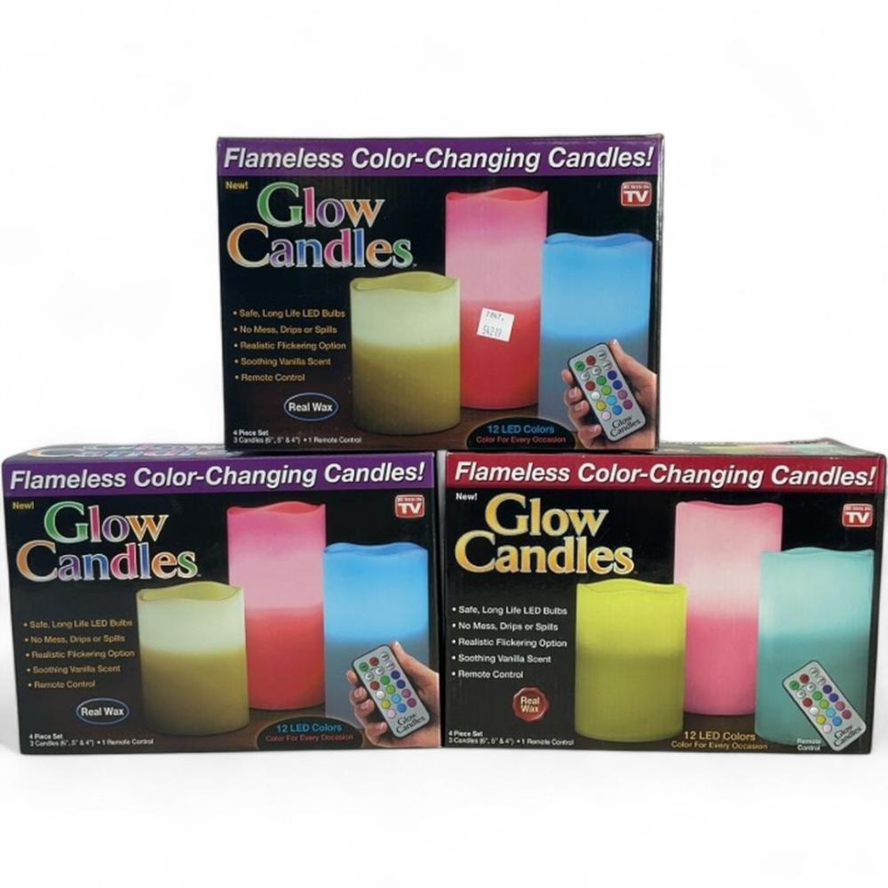 Three boxs of four piece glow candles with remote