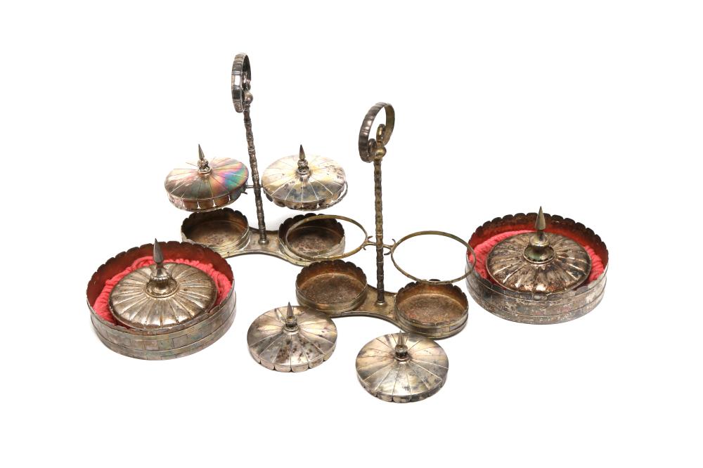 A group of silver vessels comprising trays and holders