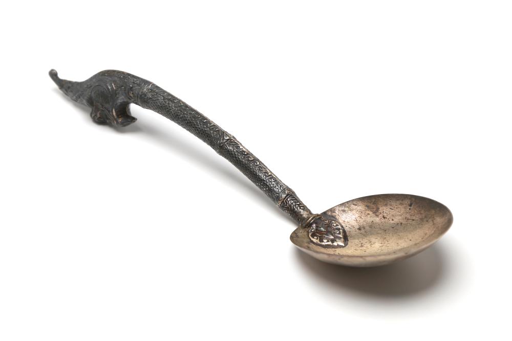 A silver ladle decorated with Naga at handle