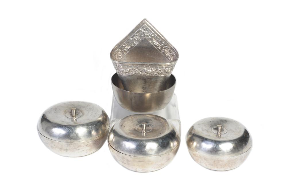 A carved and repousse' silver betel nut set in the shaped of fruits