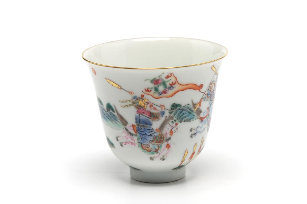 A polychrome porcelain teacup painted with warriors in combat (Decorative Art)