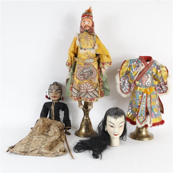 Three Indonesian and Southeast Asian puppet dolls.