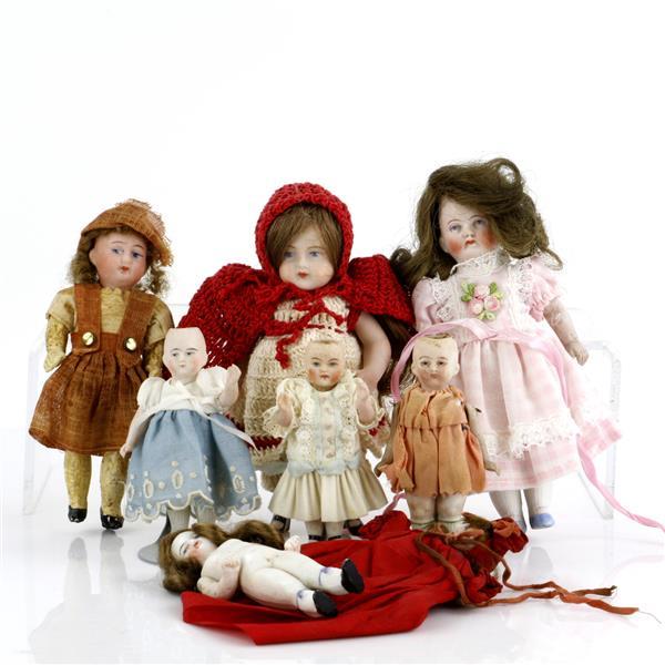 Seven german bisque dolls including all-bisque bodies.
