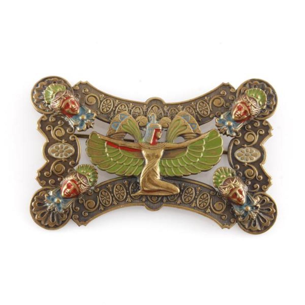 Egyptian Revival Czech brass and enamel Art Deco layered pin brooch with central winged goddess in relief. Manner of Neiger Bros.