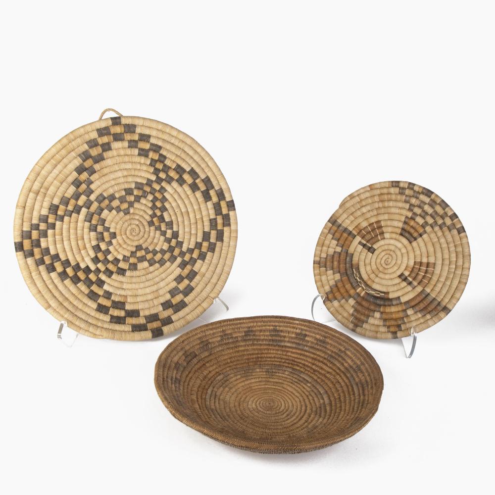 Diné [Navajo] + Hopi, Group of Three Basket Plaques: Wedding Basket, ca. 1930s + Pictorial Plaque Basket with Sun Face Katsina, ca. 1950 + Coiled Plaque Basket, ca. 1950