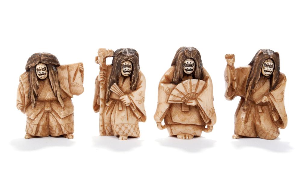 SET OF FOUR CARVED AND STAINED DOUBLE FACE NETSUKE