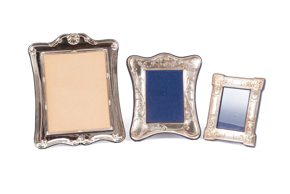 TWO STERLING PICTURE FRAMES AND ANOTHER