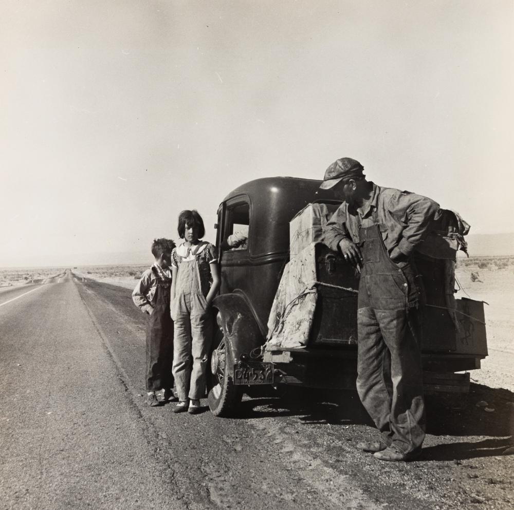 DOROTHEA LANGE (1895-1965) Oklahoma sharecropper and family entering Calif. stalled on the desert near Indio, California.