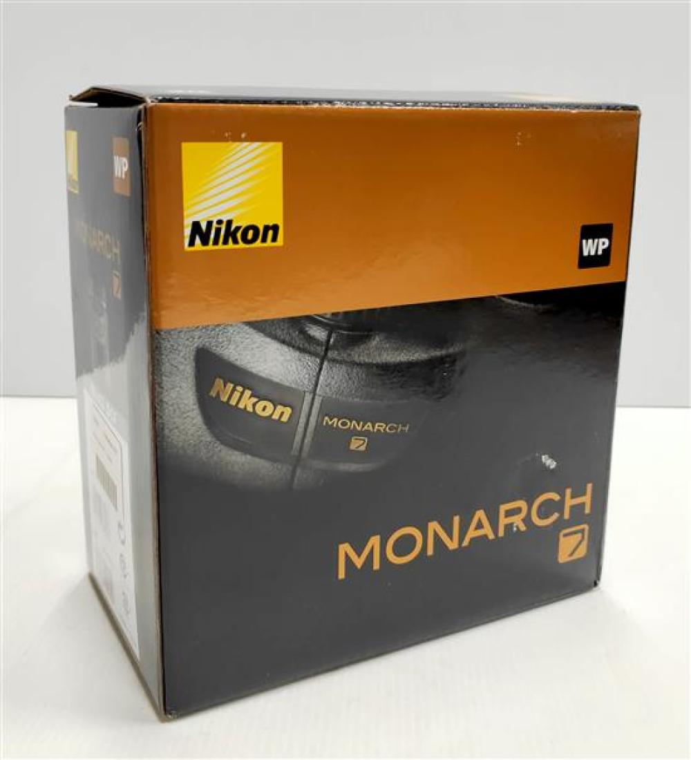 A pair of binoculars marked Nikon Monarch 7 in open box