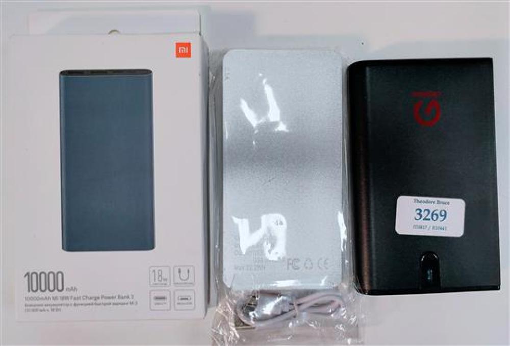 Three assorted power banks, marked MI etc.