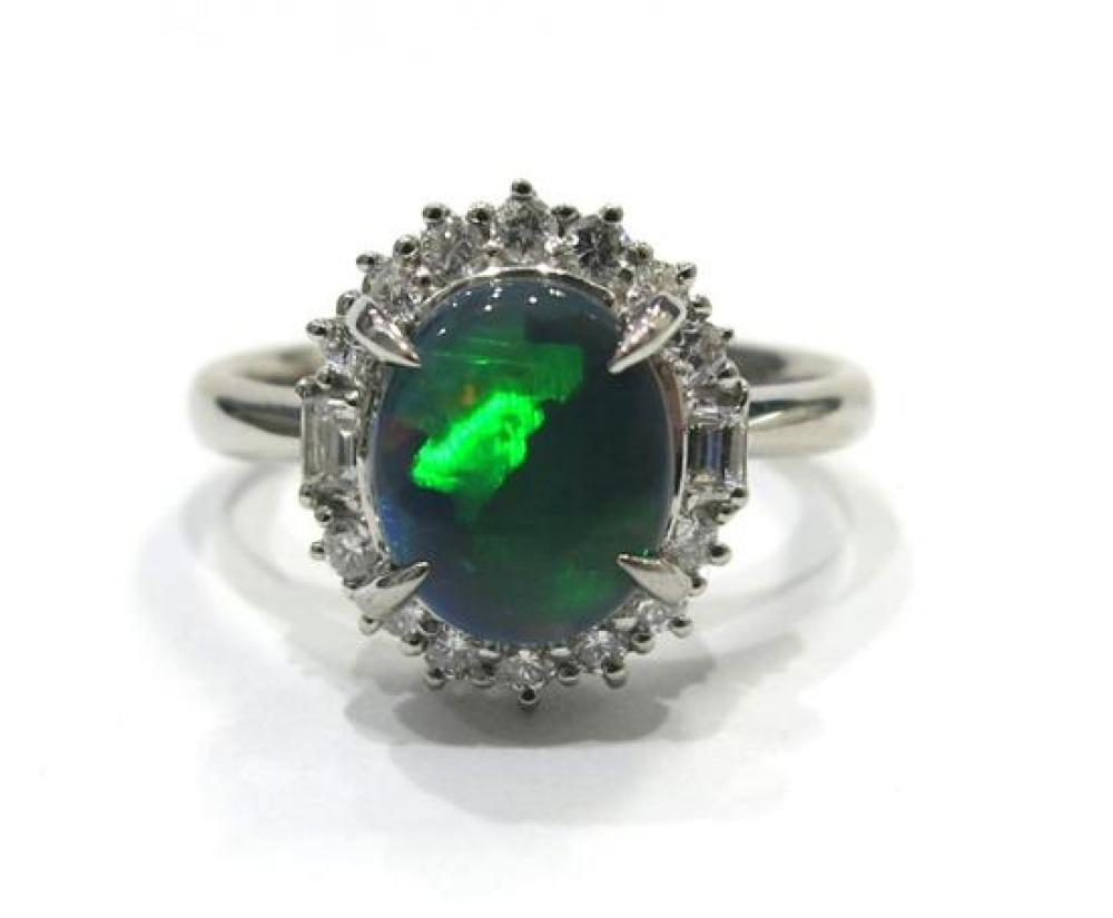 An 18ct White Gold Solid Black Opal & Diamond Ring,