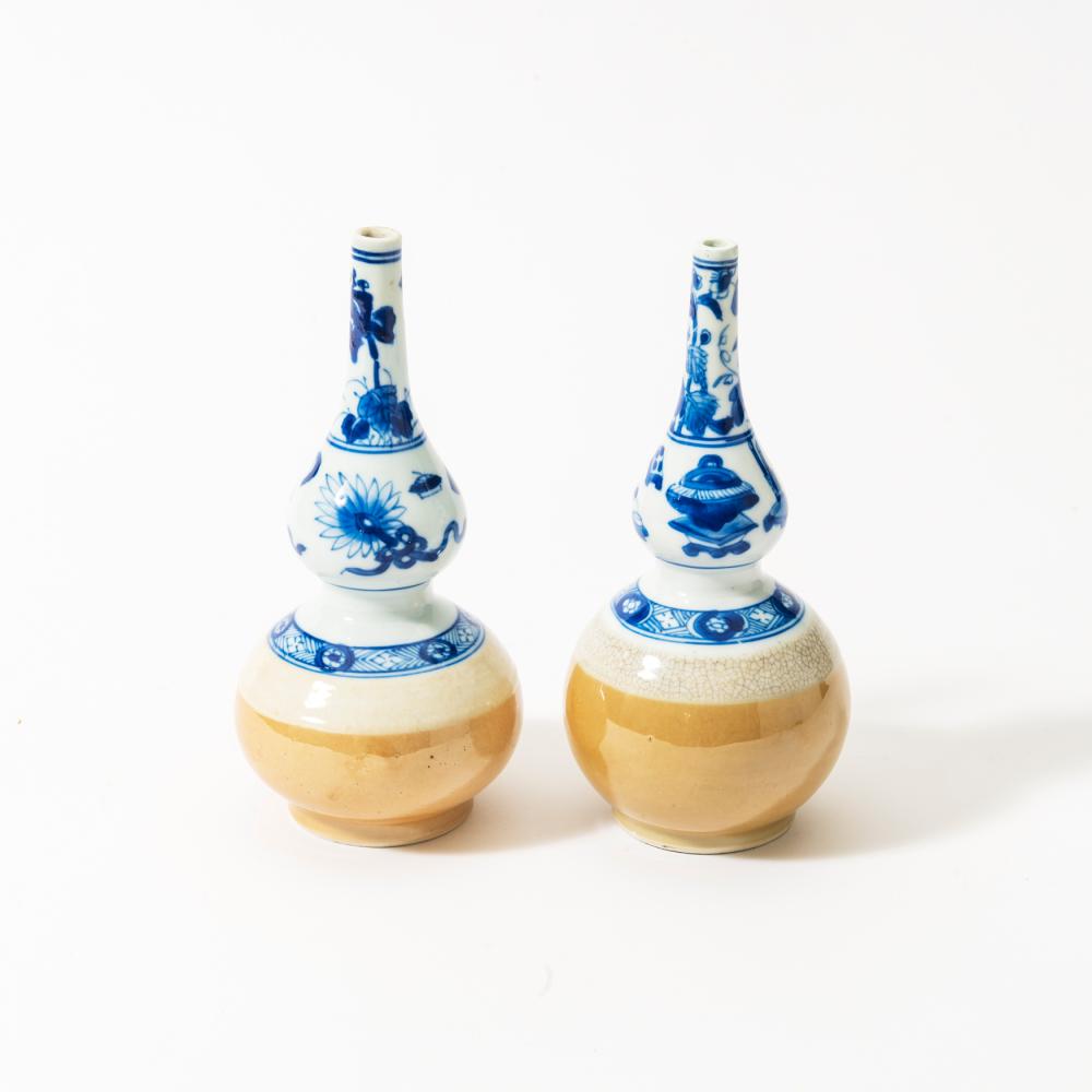 A NEAR PAIR OF CHINESE BLUE AND WHITE AND CAFÉ-AU-LAIT-GLAZED ROSEWATER SPRINKLERS